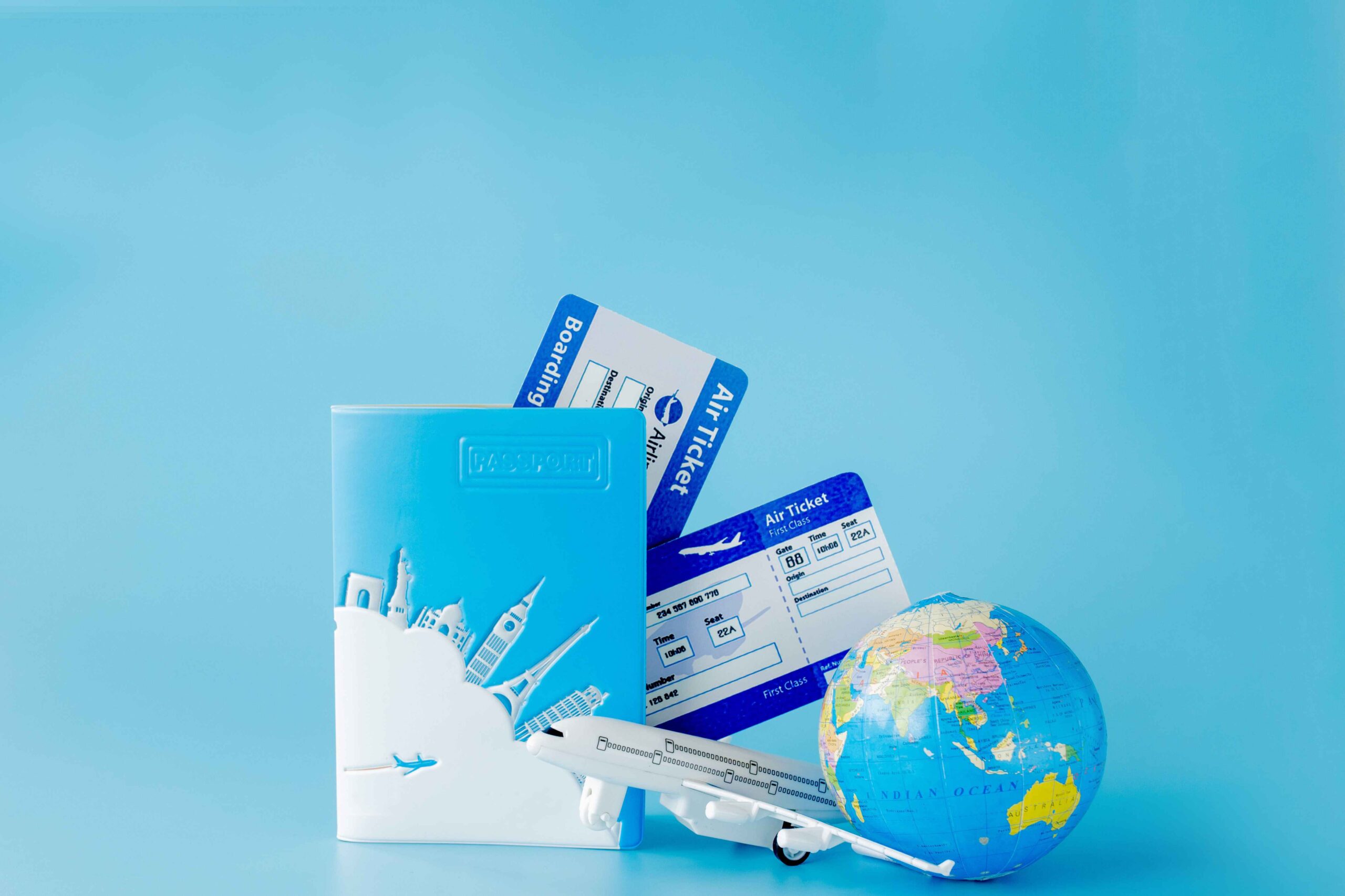 flight tickets with passports model airplane globe summer vacation concept copy space scaled